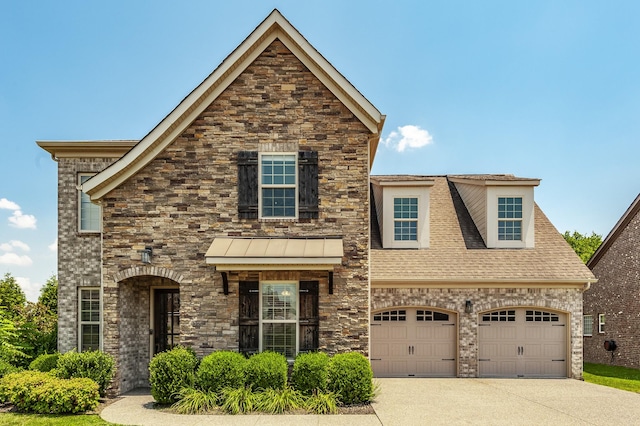 1328 Reynard Dr, Gallatin, TN 37066 - view of front of house featuring concrete driveway, stone siding, and roof with shingles