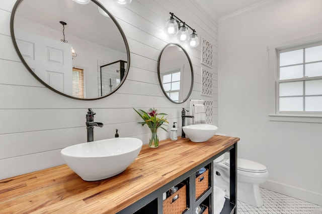 2779 Landcashire Ct, Thompsons Station, TN 37179 - bathroom featuring crown molding, tile patterned flooring, double vanity, a shower, and wooden walls