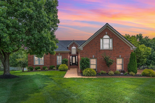 2779 Landcashire Ct, Thompsons Station, TN 37179 - traditional-style home with a yard and brick siding