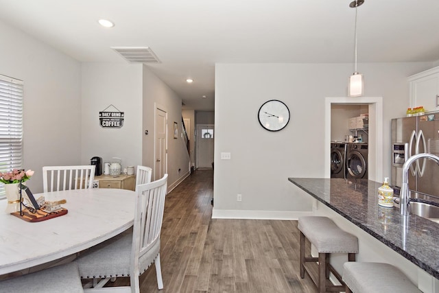 2163 Bayport Ave, Old Hickory, TN 37138 - dining area featuring washer and dryer, light wood-style flooring, and recessed lighting
