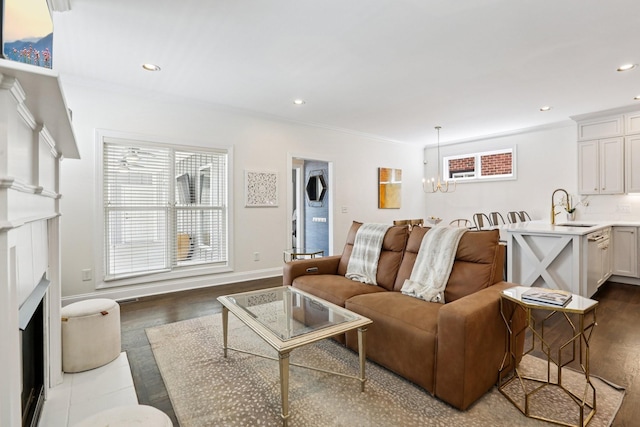 305 White Moss Pl, Franklin, TN 37064 - living area featuring a chandelier, a fireplace with flush hearth, recessed lighting, ornamental molding, and dark wood finished floors