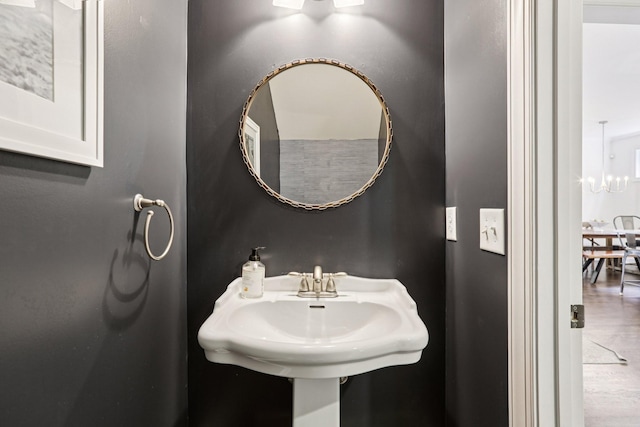 305 White Moss Pl, Franklin, TN 37064 - bathroom with a chandelier and wood finished floors
