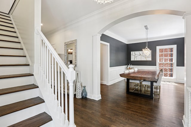 305 White Moss Pl, Franklin, TN 37064 - dining room with arched walkways, stairs, crown molding, dark wood-style flooring, and a wainscoted wall