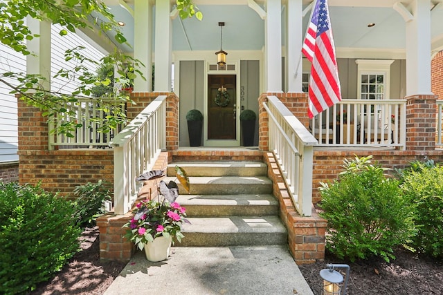 305 White Moss Pl, Franklin, TN 37064 - view of exterior entry with a porch and brick siding