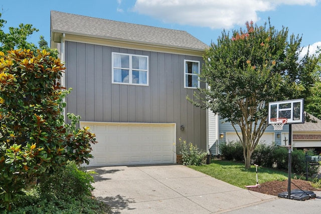 305 White Moss Pl, Franklin, TN 37064 - view of front of house with an attached garage, concrete driveway, a shingled roof, a front lawn, and board and batten siding