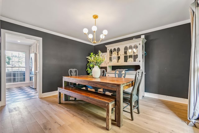 1913 Sam Houston Ct, Franklin, TN 37069 - dining space featuring light wood-type flooring, crown molding, and a chandelier