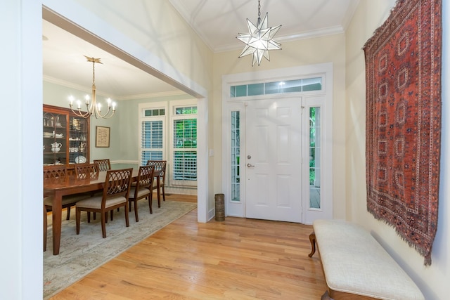 238 Wiggins Creek Dr, Sewanee, TN 37375 - foyer entrance with a chandelier, light wood finished floors, and crown molding