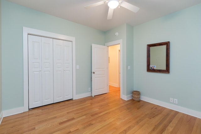 238 Wiggins Creek Dr, Sewanee, TN 37375 - unfurnished bedroom featuring light wood-style flooring, a closet, and a ceiling fan