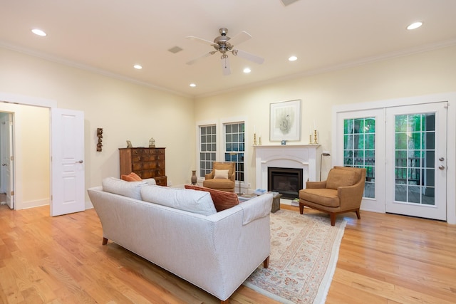 238 Wiggins Creek Dr, Sewanee, TN 37375 - living room featuring crown molding, ceiling fan, a glass covered fireplace, light wood-style flooring, and recessed lighting