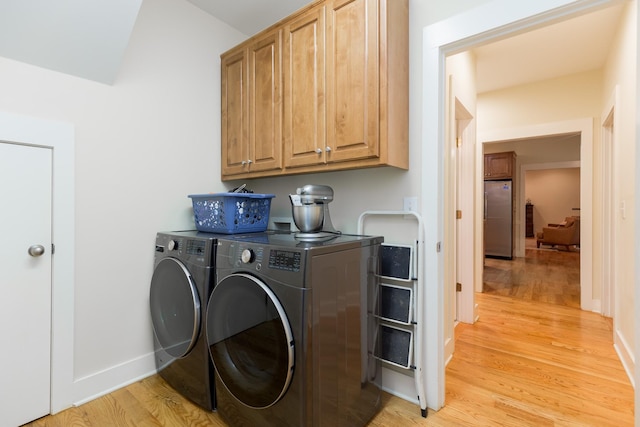238 Wiggins Creek Dr, Sewanee, TN 37375 - washroom featuring cabinet space, light wood finished floors, and independent washer and dryer