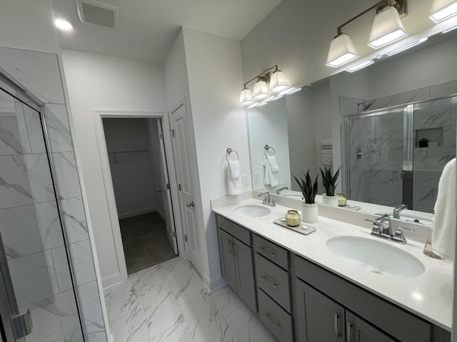 1169 Short St, Spring Hill, TN 37174 - full bathroom featuring marble look tiles, a marble finish shower, double vanity, and a walk in closet