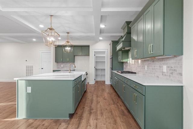 17 Peyton Pl, Columbia, TN 38401 - kitchen featuring coffered ceiling, custom range hood, green cabinets, backsplash, and wood finished floors
