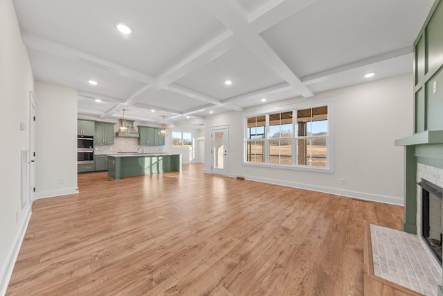17 Peyton Pl, Columbia, TN 38401 - unfurnished living room featuring a fireplace with flush hearth, coffered ceiling, light wood finished floors, beam ceiling, and recessed lighting