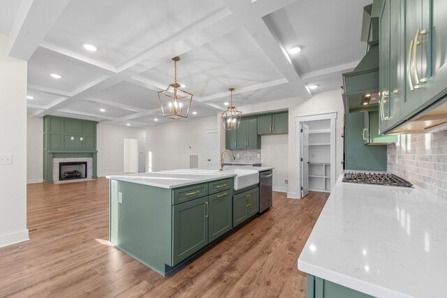 17 Peyton Pl, Columbia, TN 38401 - kitchen featuring green cabinetry, stainless steel appliances, coffered ceiling, decorative backsplash, and light countertops