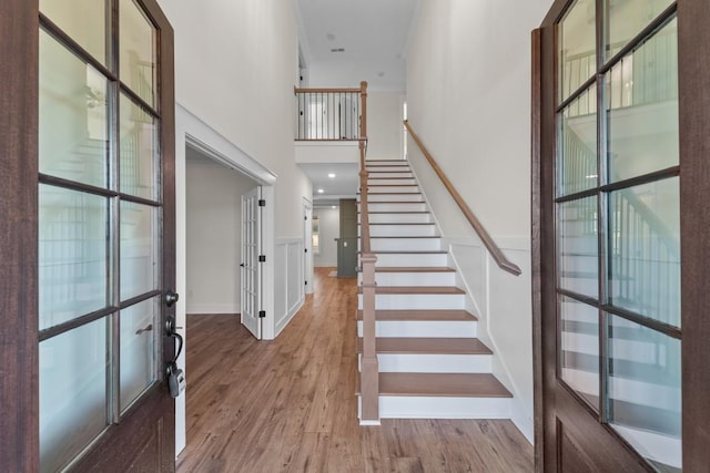 17 Peyton Pl, Columbia, TN 38401 - foyer entrance with wood finished floors, french doors, stairway, a high ceiling, and wainscoting