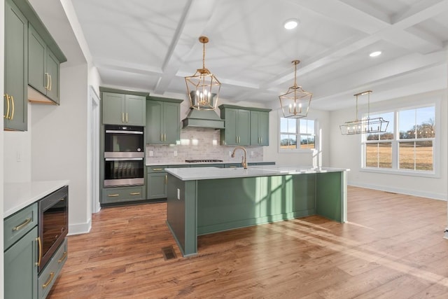 17 Peyton Pl, Columbia, TN 38401 - kitchen featuring green cabinetry, double oven, a chandelier, tasteful backsplash, and light countertops