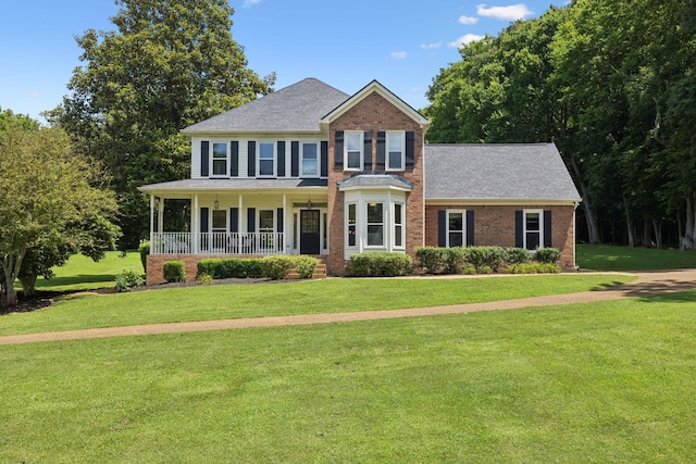 1420 Mayberry Ln, Franklin, TN 37064 - view of front of house with covered porch, a front yard, a shingled roof, and brick siding