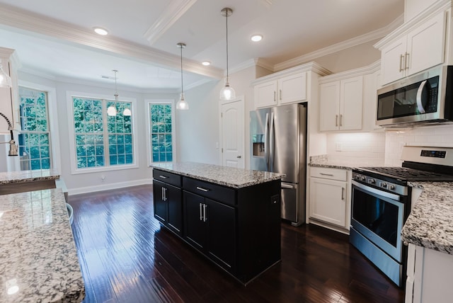 1210 Black Rd, Cunningham, TN 37052 - kitchen with appliances with stainless steel finishes, dark cabinets, white cabinets, ornamental molding, and dark wood-style floors