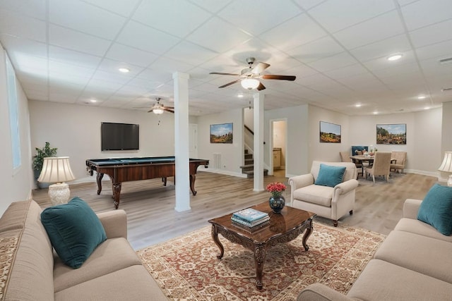 1210 Black Rd, Cunningham, TN 37052 - living room with billiards, light wood-style flooring, stairs, a ceiling fan, and a paneled ceiling