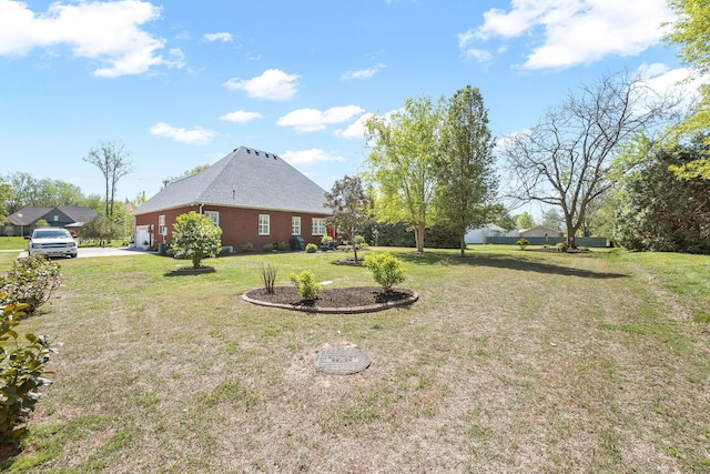 939 Central Valley Rd, Murfreesboro, TN 37129 - view of green lawn featuring driveway and a garage