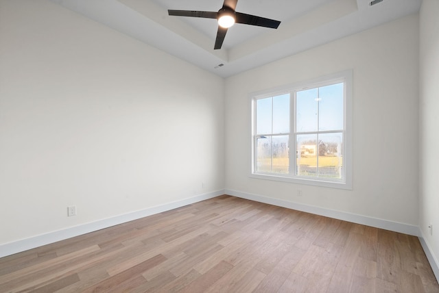 4015 Trough Springs Rd, Adams, TN 37010 - spare room with light wood-type flooring, a ceiling fan, and a tray ceiling