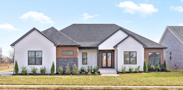 4015 Trough Springs Rd, Adams, TN 37010 - modern farmhouse with a front lawn, french doors, brick siding, and board and batten siding