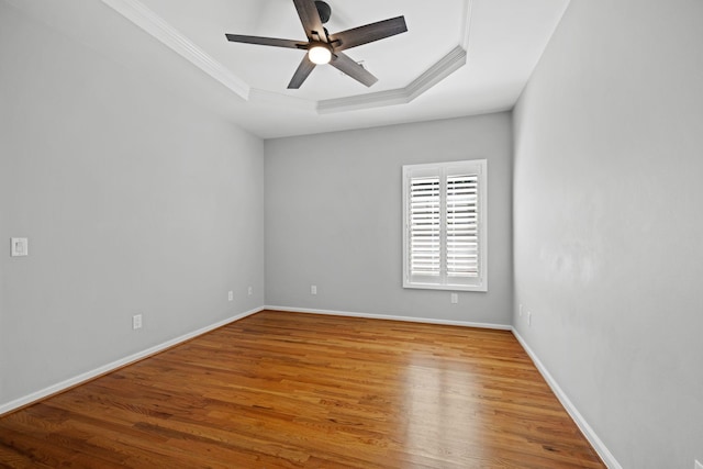 1204 Corlew Dr, Burns, TN 37029 - spare room featuring crown molding, a raised ceiling, wood finished floors, and ceiling fan