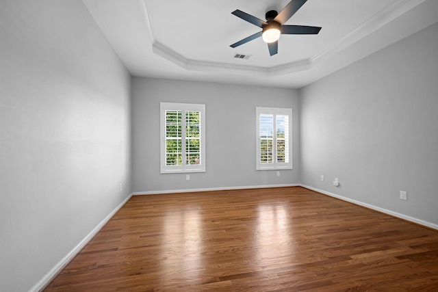 1204 Corlew Dr, Burns, TN 37029 - empty room with a raised ceiling, wood finished floors, ceiling fan, and crown molding