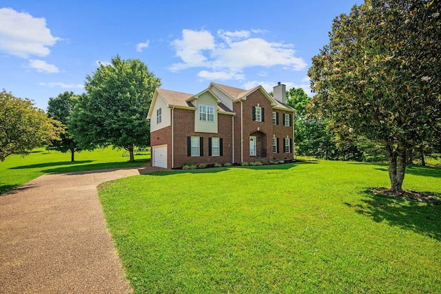 1204 Corlew Dr, Burns, TN 37029 - view of front of home featuring brick siding, driveway, a chimney, an attached garage, and a front lawn