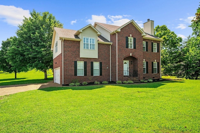 1204 Corlew Dr, Burns, TN 37029 - view of front facade with driveway, brick siding, a chimney, and an attached garage