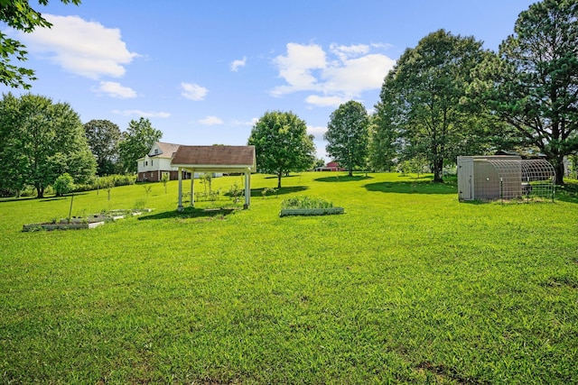 1204 Corlew Dr, Burns, TN 37029 - view of green lawn with an outbuilding