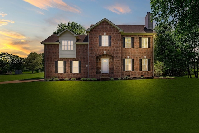 1204 Corlew Dr, Burns, TN 37029 - view of front facade featuring a chimney, a front yard, and brick siding