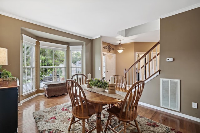 1511 Cardinal Ln, Mount Juliet, TN 37122 - dining room featuring plenty of natural light, wood finished floors, crown molding, and stairs