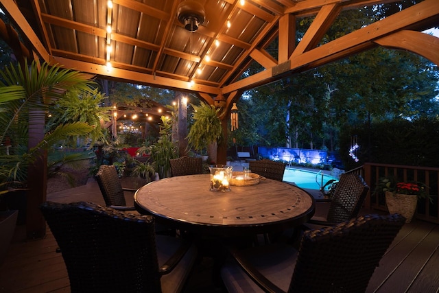 1511 Cardinal Ln, Mount Juliet, TN 37122 - deck at night featuring an outdoor pool and outdoor dining space