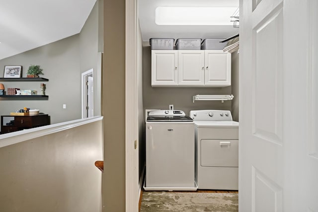 1511 Cardinal Ln, Mount Juliet, TN 37122 - washroom with washing machine and dryer, cabinet space, and wood finished floors