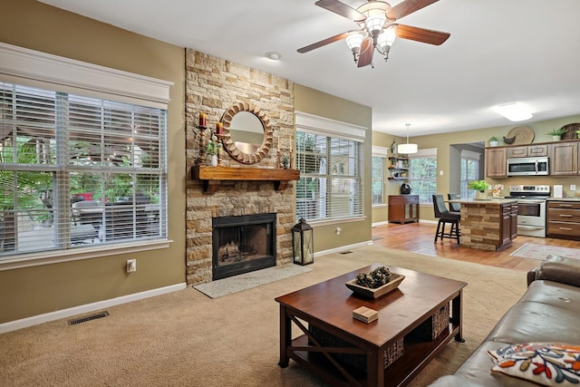 1511 Cardinal Ln, Mount Juliet, TN 37122 - living area featuring plenty of natural light, ceiling fan, and a stone fireplace