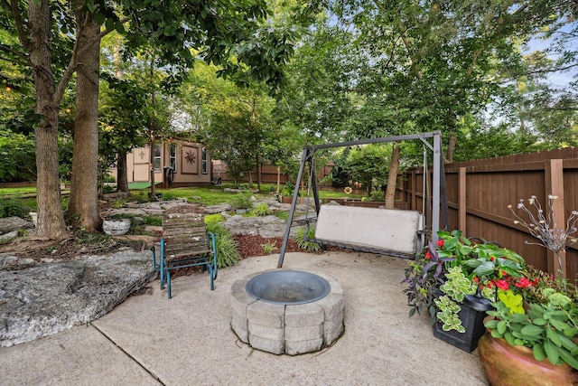 1511 Cardinal Ln, Mount Juliet, TN 37122 - fenced backyard with a patio area, an outdoor fire pit, and an outdoor structure