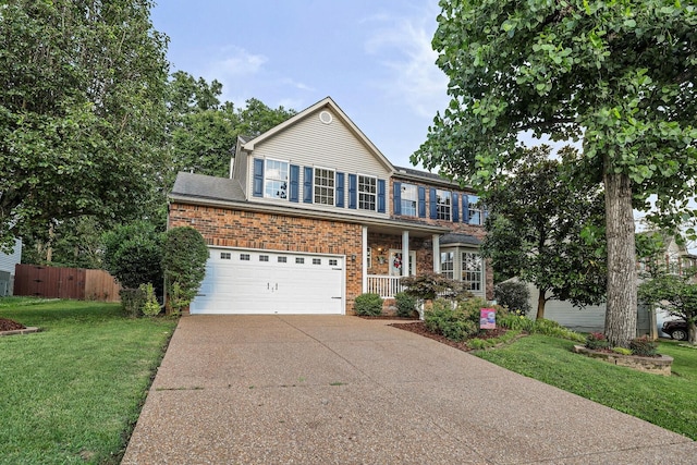 1511 Cardinal Ln, Mount Juliet, TN 37122 - view of front of house with driveway, brick siding, an attached garage, and a porch