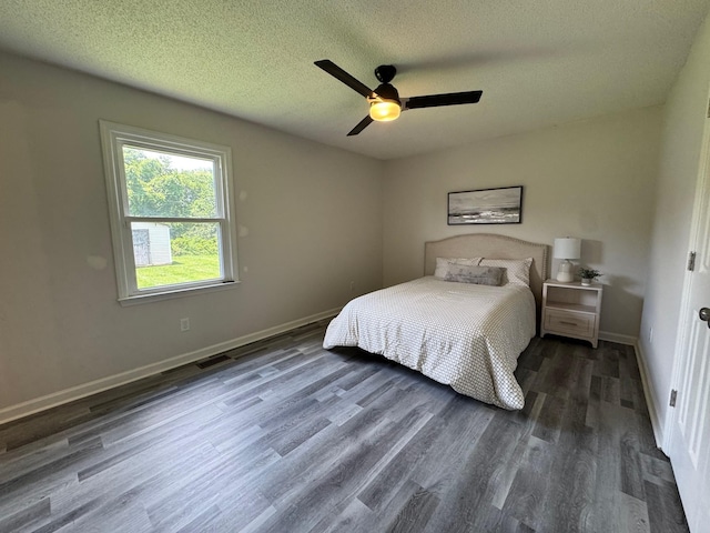 3409 Dutton Ct, Murfreesboro, TN 37130 - bedroom featuring dark wood-style flooring, a textured ceiling, and a ceiling fan
