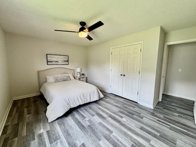 3409 Dutton Ct, Murfreesboro, TN 37130 - bedroom with wood finished floors, a closet, a textured ceiling, and a ceiling fan