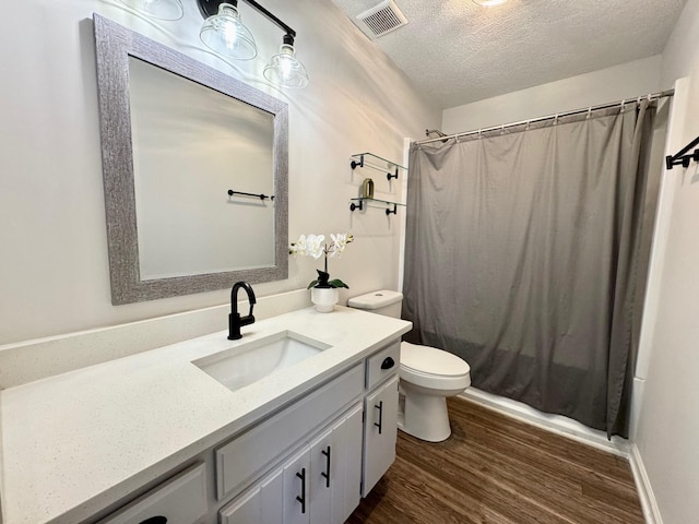 3409 Dutton Ct, Murfreesboro, TN 37130 - bathroom with vanity, wood finished floors, and a textured ceiling