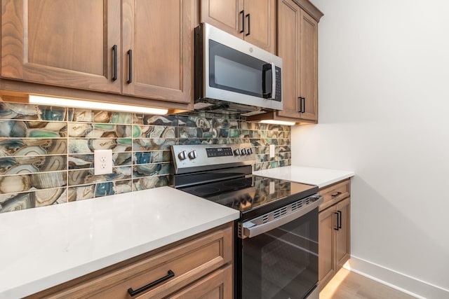 11 Dutch Dr, Clarksville, TN 37043 - kitchen featuring appliances with stainless steel finishes, backsplash, and light countertops