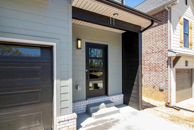 11 Dutch Dr, Clarksville, TN 37043 - view of exterior entry featuring brick siding and an attached garage
