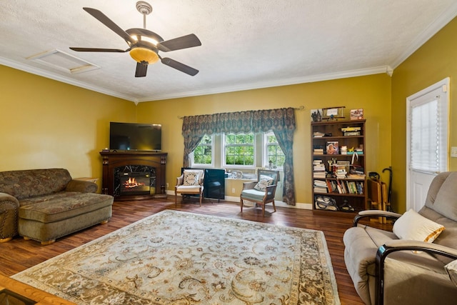 219 Lakeview Dr, Hohenwald, TN 38462 - living area featuring attic access, ornamental molding, wood finished floors, a premium fireplace, and a textured ceiling