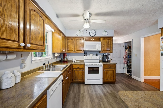 219 Lakeview Dr, Hohenwald, TN 38462 - kitchen with white appliances, brown cabinetry, dark wood finished floors, ceiling fan, and a textured ceiling