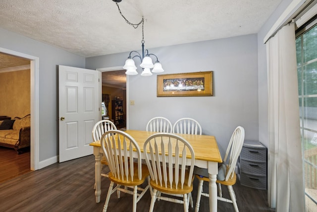 219 Lakeview Dr, Hohenwald, TN 38462 - dining space featuring dark wood finished floors, a textured ceiling, and a chandelier