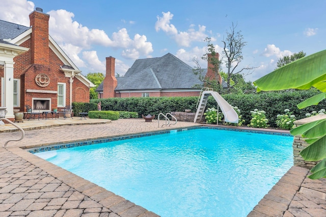 1512 Mirabella Way, Murfreesboro, TN 37130 - view of pool featuring a water slide, an outdoor brick fireplace, and a patio