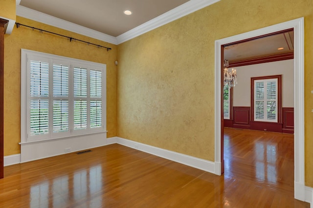 1512 Mirabella Way, Murfreesboro, TN 37130 - spare room featuring wood finished floors, a chandelier, crown molding, and wainscoting