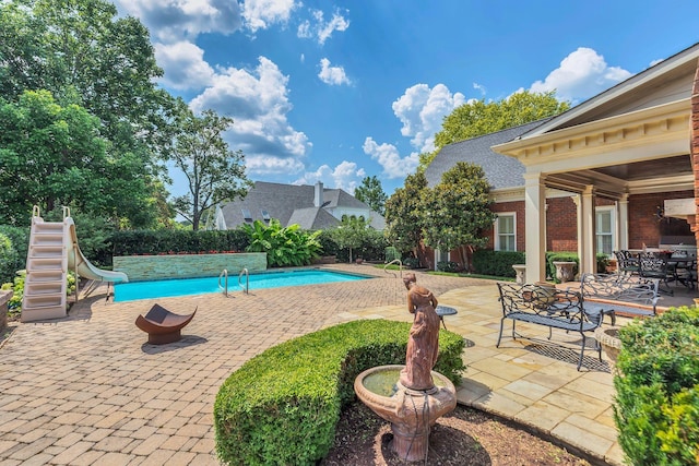 1512 Mirabella Way, Murfreesboro, TN 37130 - view of swimming pool with a water slide, a patio, and outdoor dining area