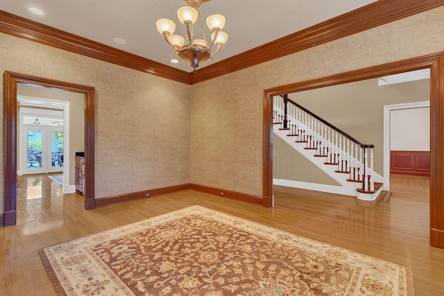 1512 Mirabella Way, Murfreesboro, TN 37130 - empty room featuring wood finished floors, crown molding, a chandelier, and stairs